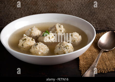 Soup with chicken meatballs in a white bowl Stock Photo