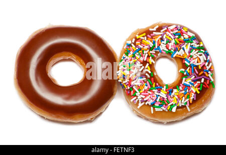 Two isolated chocolate and colorful doughnuts over white Stock Photo