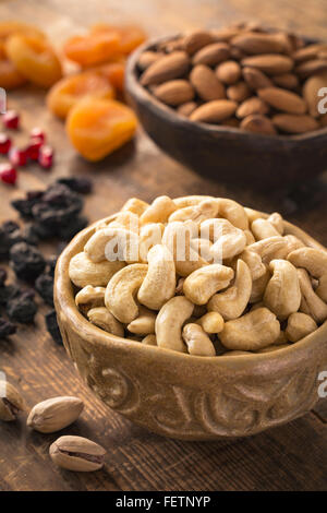 Cashews, pistachios, almonds, raisins, pomegranate seeds and dried apricots. Turkish dried fruits and nuts Stock Photo