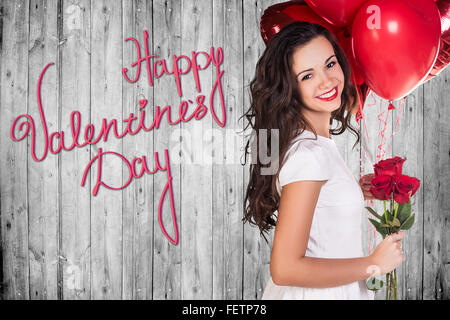 Happy Valentines Day on a gray wooden wall Stock Photo