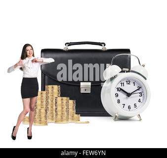 Business woman near alarm,briefcase and coins Stock Photo