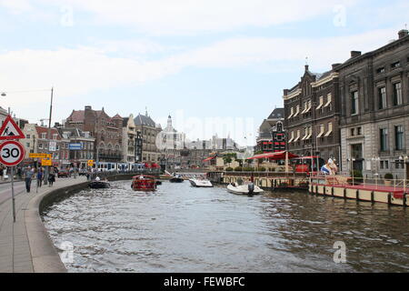 Amsterdam Rokin Canal at Oude Turfmarkt street, headquarters of Rederij Kooij canal cruises Stock Photo