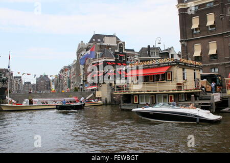 Rokin Canal at Oude Turfmarkt street, Amsterdam, Netherlands. Offices and starting point of Rederij Kooij canal cruises. Stock Photo