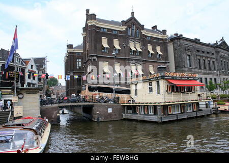 Rokin Canal at Oude Turfmarkt street, Amsterdam, Netherlands. Headquarters of Rederij Kooij canal cruises. Stock Photo