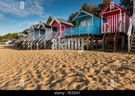 Colourful wooden beach huts on sandy beach of Wells next-the-Sea, Norfolk, UK Stock Photo
