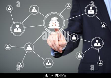 Businessman pushing button with icon dollar virtual. technology, internet and networking concept. Stock Photo