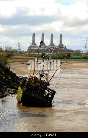 Connah’s Quay Power Station, on the River Dee Estuary, with a sunken boat in the esturary, Flintshire, North Wales, UK Stock Photo