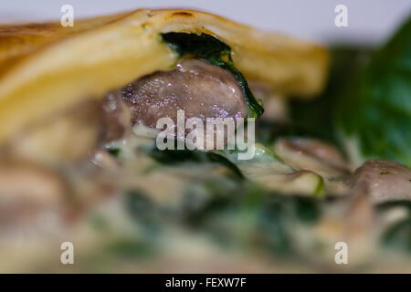 Tourte au Bleu: Blue cheese mushroom pie. Spinach and mushroom melted with Irish blue cheese then topped with puff pastry Stock Photo