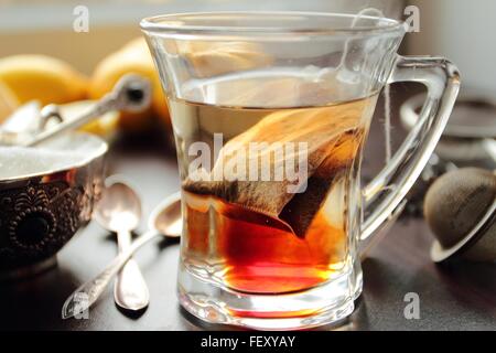 Hot tea cup with tea bag inside Stock Photo