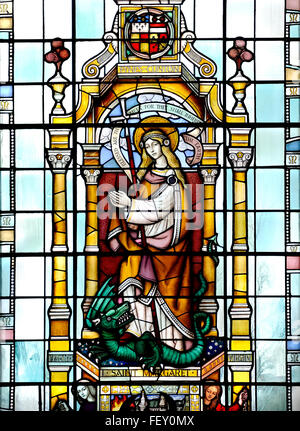 London, England, UK. Church of St Magnus the Martyr. Interior. Stained glass window. St Margaret / Margaret of Antioch in the We Stock Photo