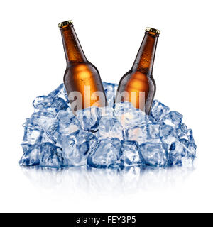 Two brown beer bottles, cooling down in a rough crushed ice. Clipping paths Stock Photo