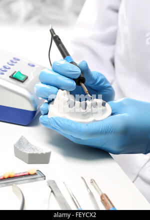 Prosthetics.. Dentures, partial dentures. Prosthetist at the dental bridge work Stock Photo