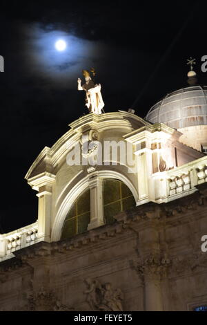 A full moon shines above St. Blaise Church in the Old City of Dubrovnik, Croatia. Stock Photo