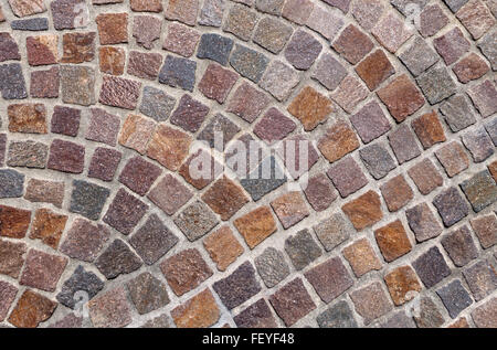 Pattern of colored cobblestones in brown, purple, gray and blue in close-up Stock Photo