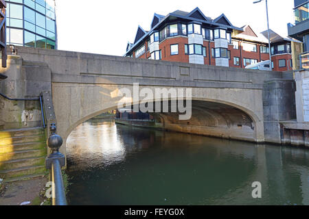 A concrete constructed bridge spanning the river Kennet carrying the King's road over the river, with offices either side. Stock Photo