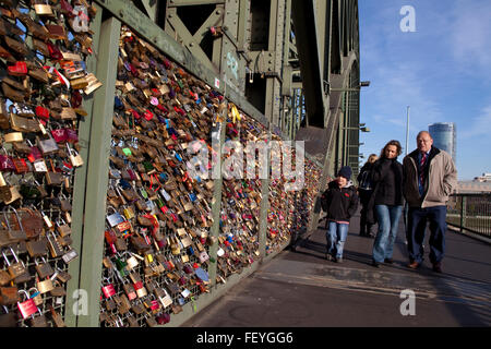 Europe, Germany, Cologne, padlocks on fence of footpath of the Hohenzollern railway bridge.  Europa, Deutschland, Koeln, Vorhaen Stock Photo