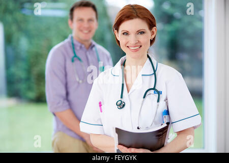 Doctor and nurse discussing notes Stock Photo