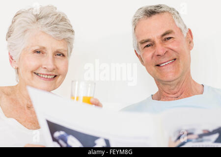 Senior couple reading newspaper Stock Photo