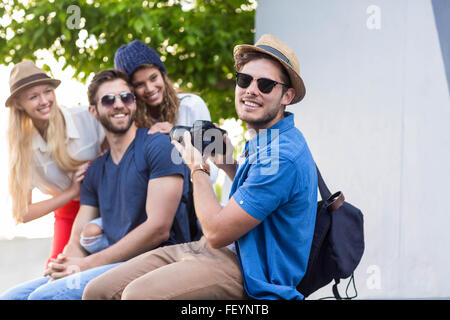 Hip friends taking pictures Stock Photo