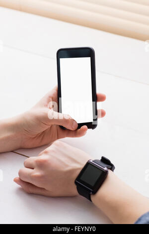 Casual businessman using phone and smart watch Stock Photo