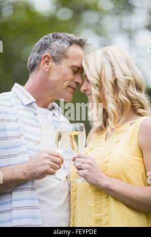 Happy couple drinking champagne Stock Photo