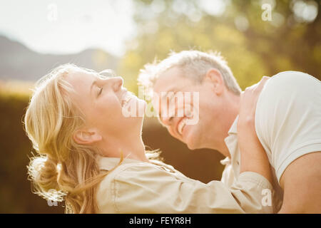 Husband kissing wife on the neck Stock Photo