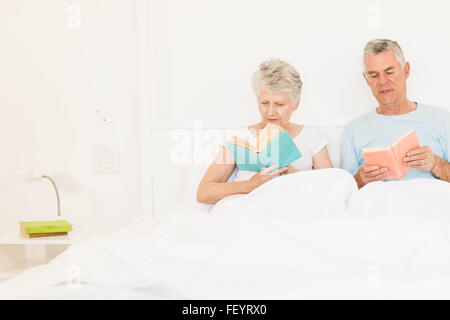 Senior couple reading books Stock Photo