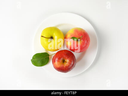 plate of apples on white background Stock Photo