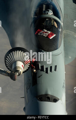 An U.S. Air Force KC-135 Stratotanker from the 340th Expeditionary Air Refueling Squadron refuels a F-18 from the Royal Canadian Air Force over Southwest Asia in support of Operation Inherent Resolve, Dec. 4, 2015. OIR is the coalition intervention against Daesh. Stock Photo