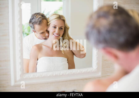 Husband kissing wife on the neck Stock Photo