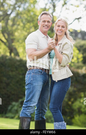 Cute couple dancing and holding hands Stock Photo
