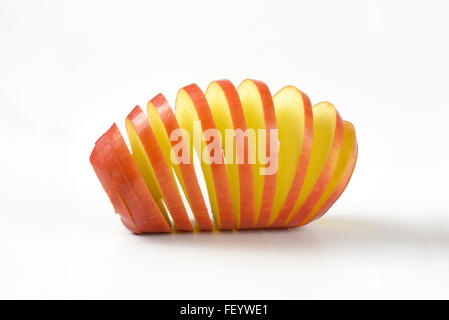 close up of fresh apple spiral on white background Stock Photo