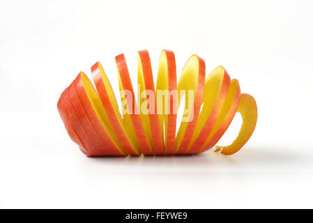 close up of fresh apple spiral on white background Stock Photo