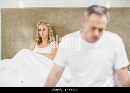 Upset couple sulking each other Stock Photo