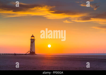 Talacre beach and the Point of Ayr Lighthouse at sunset. Stock Photo