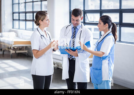 Medical team standing and talking Stock Photo