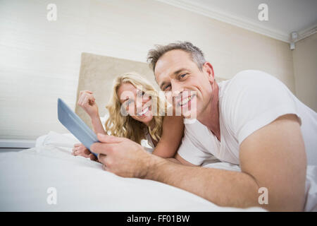 Cute couple using tablet Stock Photo