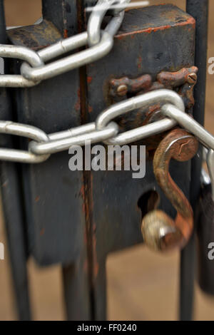 chain on old rusted metal gate Stock Photo