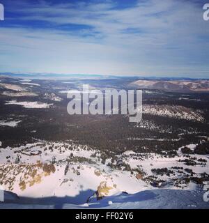 View from the top of Mammoth mountain, covered in snow. Stock Photo