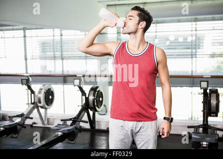 Standing man drinking water Stock Photo