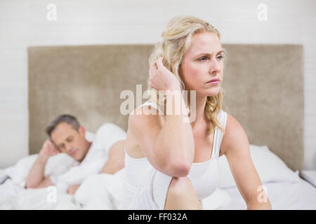 Upset couple sulking each other Stock Photo