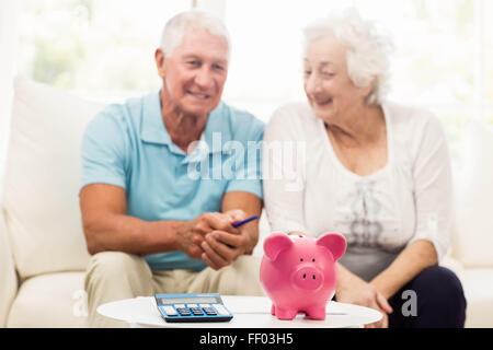 Senior couple saving money Stock Photo