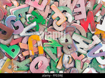 old wooden letters in a pile Stock Photo