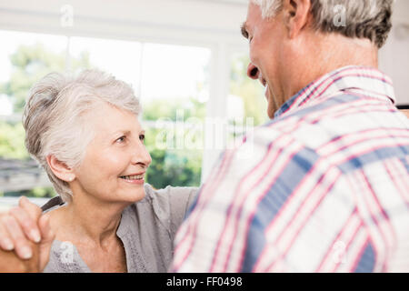 Smiling senior couple dancing Stock Photo