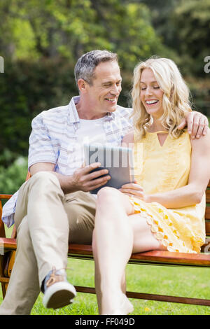 Happy couple using tablet Stock Photo