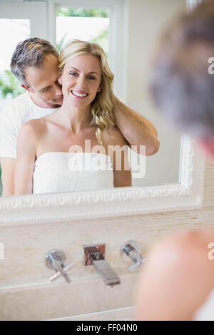 Husband kissing wife on the neck Stock Photo