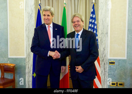 U.S. Secretary of State John Kerry Shakes Hands with Italian Foreign Minister Paolo Gentiloni at the Italian Foreign Ministry in Rome, Italy, on December 13, 2015, Before a Meeting With their Regional Counterparts About the Future of Libya Stock Photo