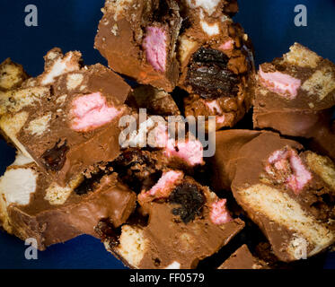 Rocky Road confectionery. Biscuit, raisin, marshmallow and melted milk chocolate mixed together and allowed to set. Fridge cake. Stock Photo