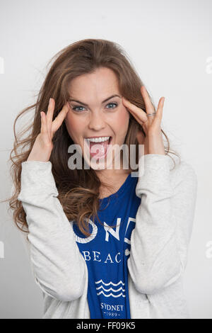 woman with a surprised and excited expression Stock Photo