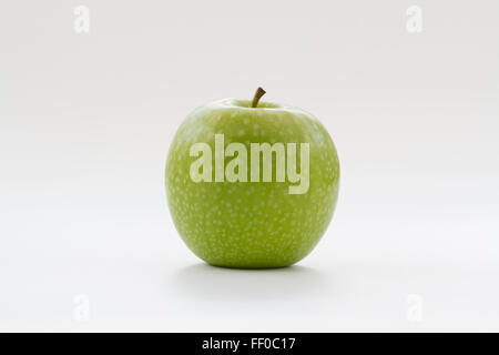 A fresh, green apple on an isolated white background. Stock Photo